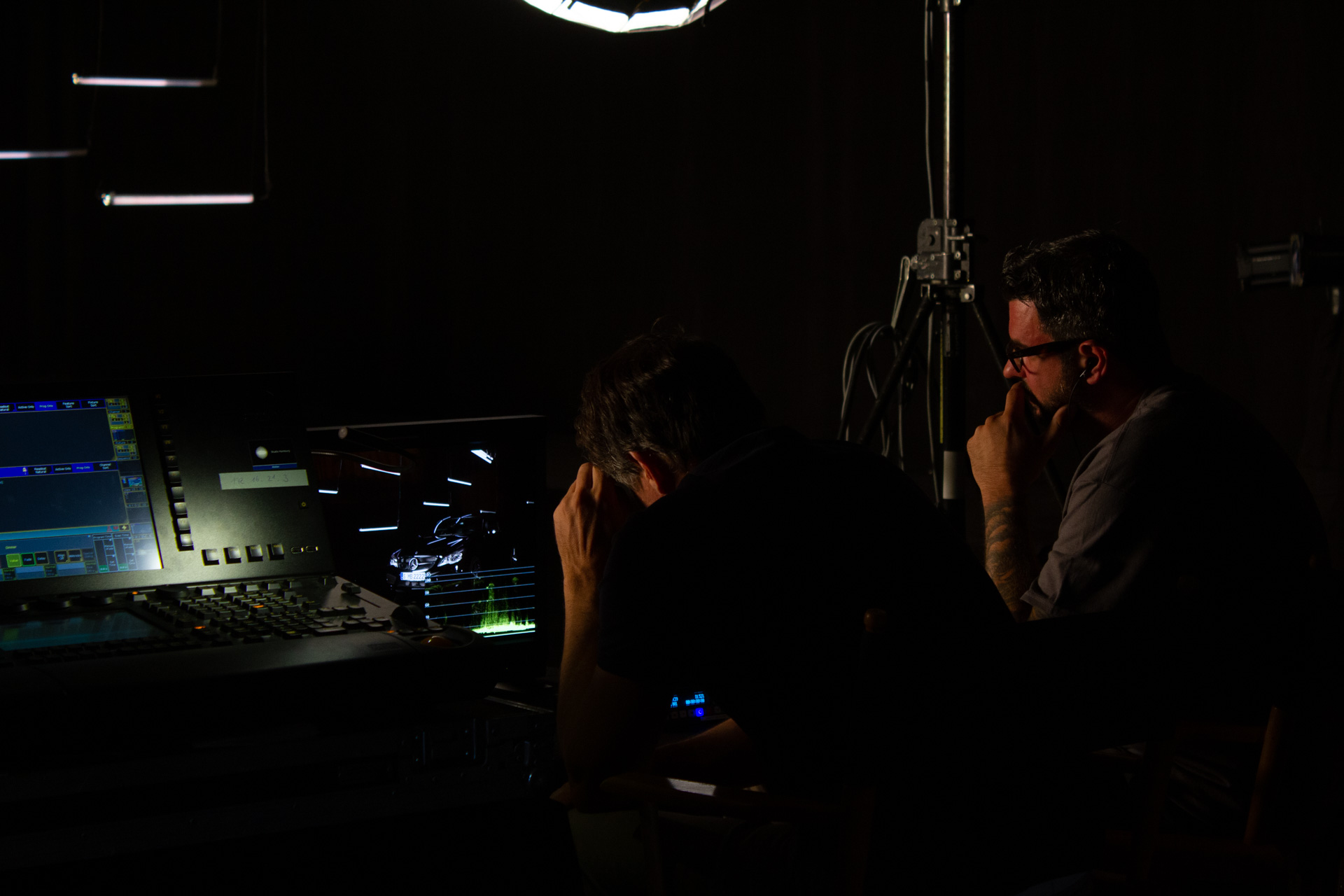 Film crew checking the preview on a screen